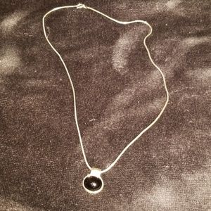 Silver necklace with black stone pendant